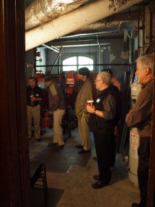 Examining the historic furnace in the Haas-Lilienthal House