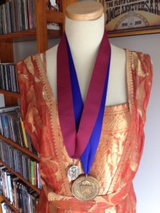 I keep my AIA Fellow's Medal (left) and Dean's Medal from the University at Buffalo School of Architecture & Planning on my manikin which wears my antique evening gown.