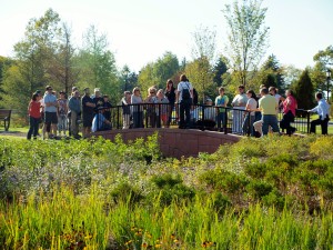 A landscape tour ends on the new bridge, one of the most popular  places to congregate on the South Lawn.  The lush rain gardens frame the bridge.